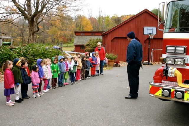 Firefighters teach fire safety to children at the Boulder Knoll Montessori School (October 2009).
